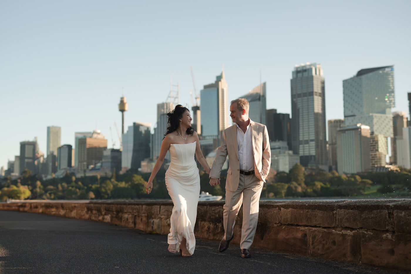 May and Shane walking, city skyline